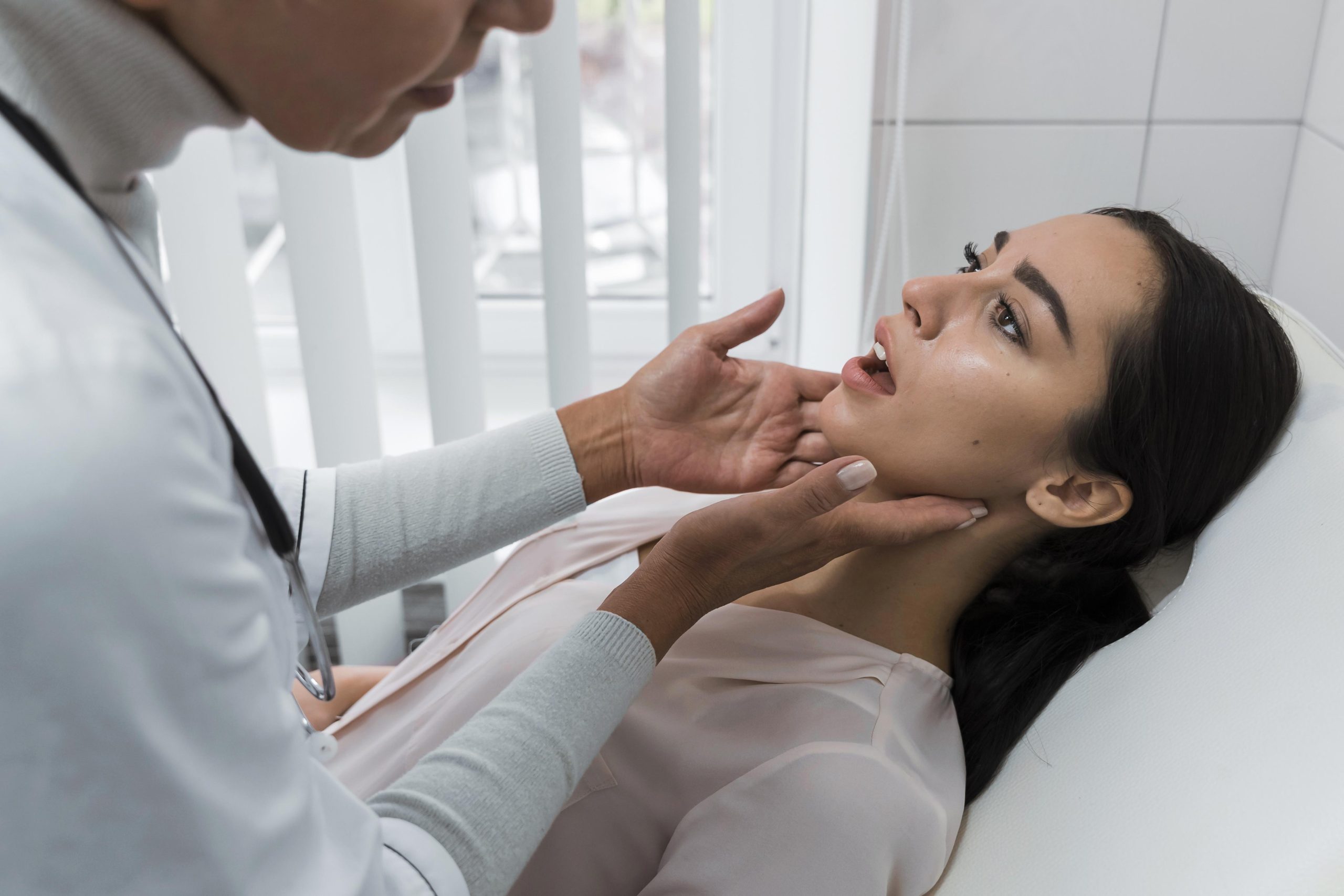 doctor checking patient mouth