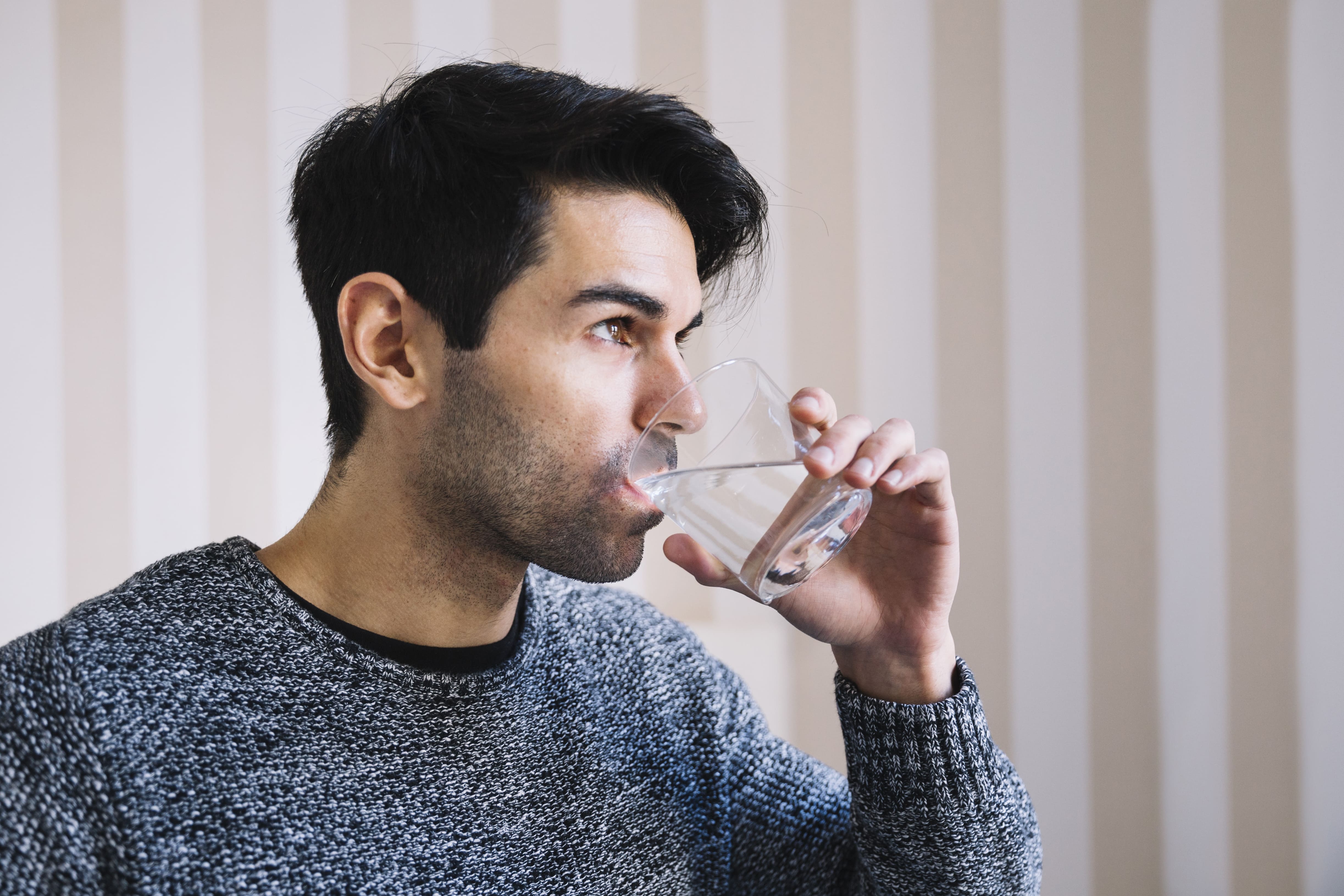 man drinking water