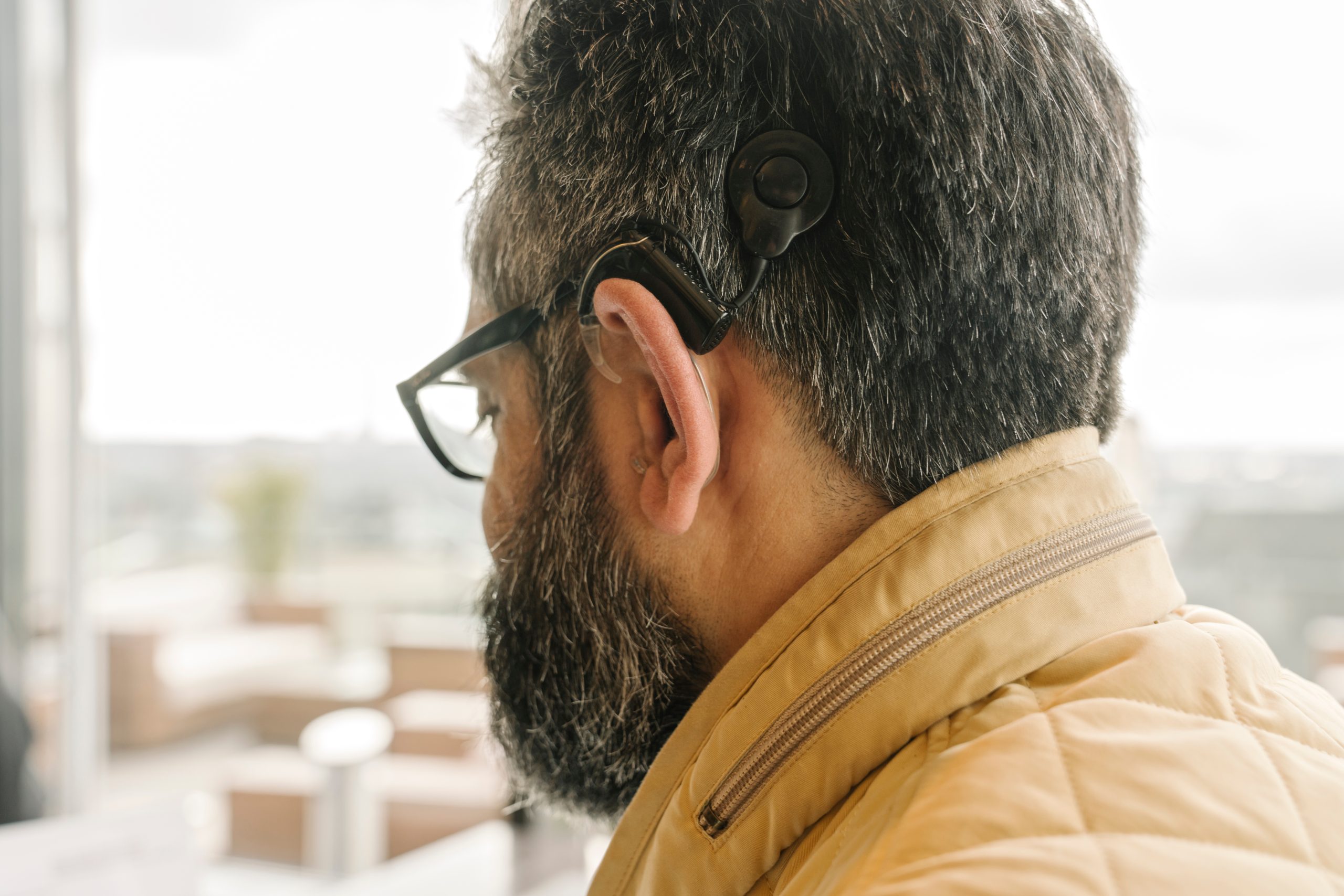 profile-of-a-man-with-a-cochlear-implant-scaled